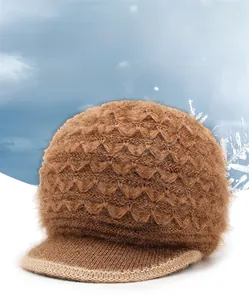 Detail of a warm dark brown knit hat with furry texture and rhinestone LOVE ornament