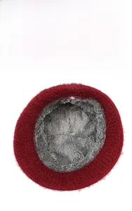 Close-up of winter knit hat showing thick burgundy knit and grey faux fur fleece lining