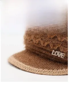 Detail of winter knit hat featuring rhinestone LOVE emblem and warm fleece texture