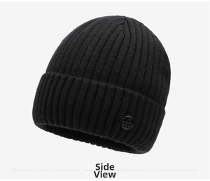 Close-up of black ribbed knit beanie with metallic logo and warm winter texture