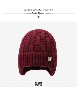 Detail of wine red knitted winter hat for women with plush lining and rhinestone butterfly