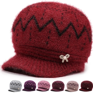 Close-up of fluffy knitted hat for elderly women with pearl bow and color options