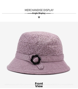 Close-up of elegant purple floral bucket hat with textured fabric and flower buckle detail