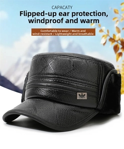 Macro detail of black PU leather winter cap with quilted pattern and warm faux fur lining