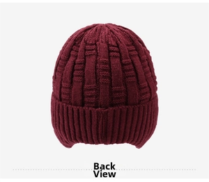 Detailed back view of a burgundy knit beanie showing thick checkered texture and ribbed hem