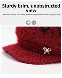 Close-up of winter knit hat featuring a golden rhinestone bow and pearl decoration
