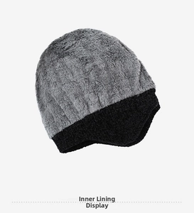 Detailed close-up of thick grey faux fur lining and black knitted earflap beanie for men