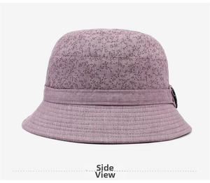 Side view of floral pink bucket hat with elegant weave texture and decorative button