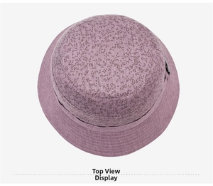 Top view of a purple cotton linen bucket hat with dark floral leaf patterns for women