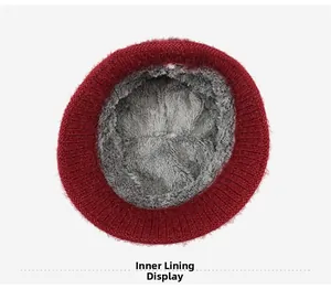 Detailed view of the thick gray plush faux fur lining inside a warm winter knit hat