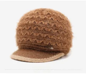 Detail of dark brown knit hat featuring wavy textures and LOVE rhinestone embellishment