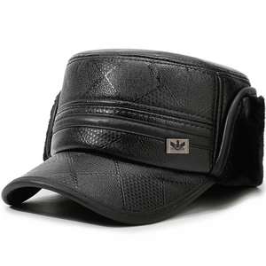 Macro detail of black leather winter hat with quilted pattern and warm faux fur ear flaps