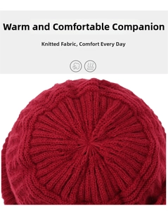 Close-up of the radial knit pattern and thickened wool fabric of the red beanie hat