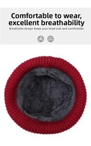Detailed view of winter knit hat with red exterior and thick grey fleece lining