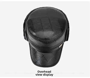 Top view of black faux leather flat cap with quilted texture and winter ear protection