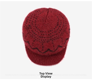 Top view of dark red knit hat for women featuring a black wavy pattern and a short brim