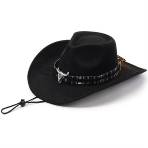 Detail of black western cowboy hat with ethnic woven band and silver bull head ornament