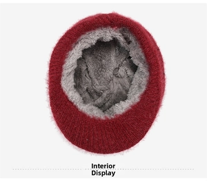 Detail view of the warm grey plush lining inside the burgundy winter knitted hat