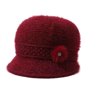 Dark red knit hat for elderly women featuring sparkling metallic thread and plush floral detail