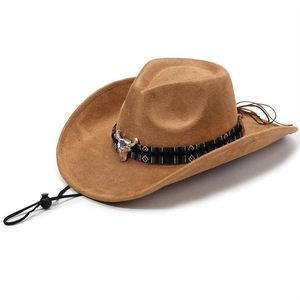 Detail of brown suede cowboy hat featuring a silver bull head and ethnic pattern band