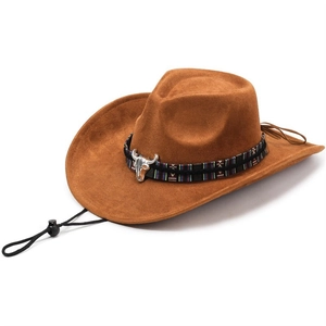 Close-up of brown western cowboy hat with ethnic braided band and metal bull head badge