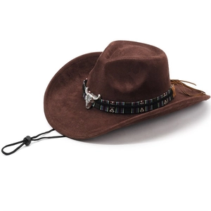 Close-up of brown suede cowboy hat with ethnic band and silver bull head metal ornament