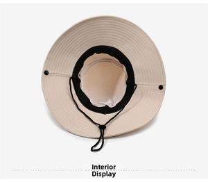 Interior details of beige sun hat with black sweatband, adjustable cord and snaps