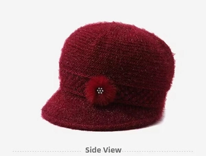 Close-up of side floral decoration on wine red knitted beanie hat for elderly women