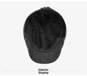 Detail view of the inner lining and neat stitching of the dark grey herringbone beret cap