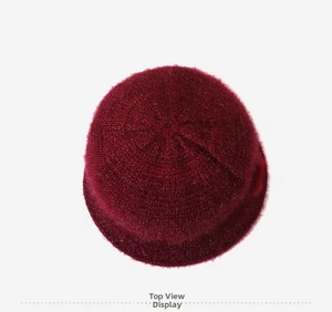 Top view of a deep red knit cloche hat featuring fuzzy mohair texture and warm lining
