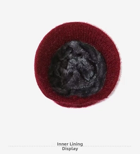 Detail of soft thick plush lining and burgundy knit exterior on winter warm hat