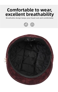 Detail of burgundy beret featuring quilted lining, adjustable drawstring and pearl charm