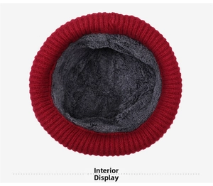 Detailed view of the thick gray fleece lining inside a red knitted winter hat for women