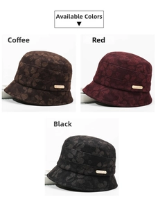 Detail of octagonal beret hats showing textured heart petal patterns and metal logos