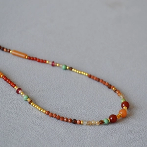 Detailed macro shot of vintage multilayer beaded necklace with authentic stone textures