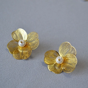 Exquisite 3D double-layer hollow gold flower stud earrings with elegant central pearl accents
