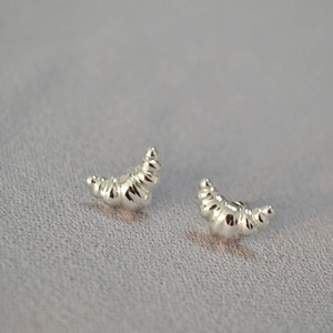 Polished S925 sterling silver croissant stud earrings with textured fold details