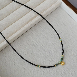 French retro beaded necklace with black spinel, turquoise, and star medal pendant