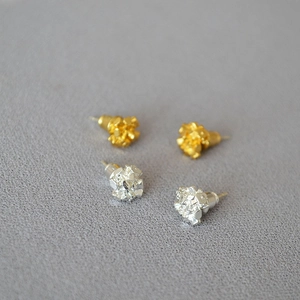 Detailed view of irregular crystal texture gold and silver plated brass stud earrings