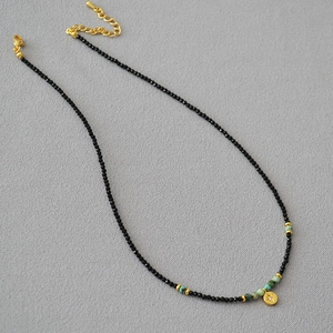 French vintage beaded necklace with black spinel, turquoise, and a gold star pendant