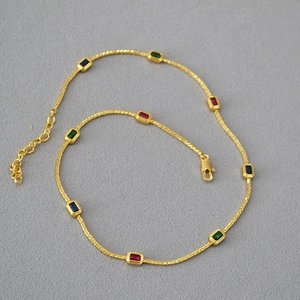 Gold plated brass necklace with multi-colored rectangular gemstones and lobster clasp