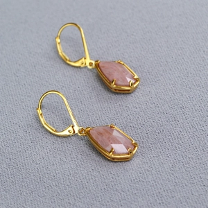 Elegant leverback earrings featuring faceted pink quartz stones in a gold-plated setting