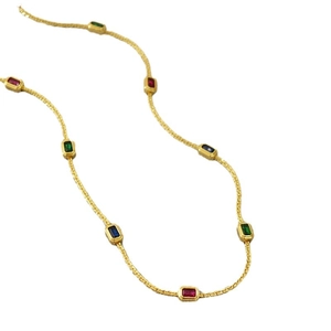 Gold chain necklace featuring rectangular colored gemstones in ruby, sapphire, and emerald tones