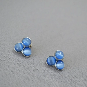 Minimalist silver clover earrings with three blue cat-eye stones for a classic look