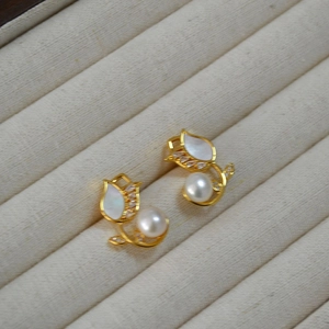 Elegant gold tulip stud earrings with freshwater pearls and shell petals in jewelry box