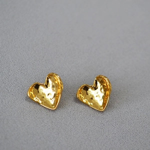 Vintage textured heart stud earrings in gold finish with a unique hammered metal surface
