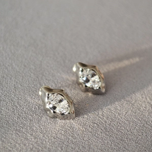 Irregular lava design silver stud earrings with sparkling oval zircon for women