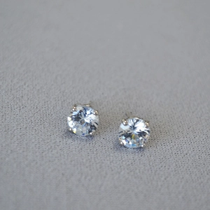 Classic silver four-prong stud earrings with brilliant round sparkling cubic zirconia stones