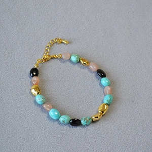 Detail of baroque turquoise and gold beaded necklace with adjustable lobster clasp