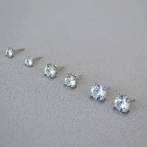 Detail of six pairs of sterling silver stud earrings with sparkling cubic zirconia stones